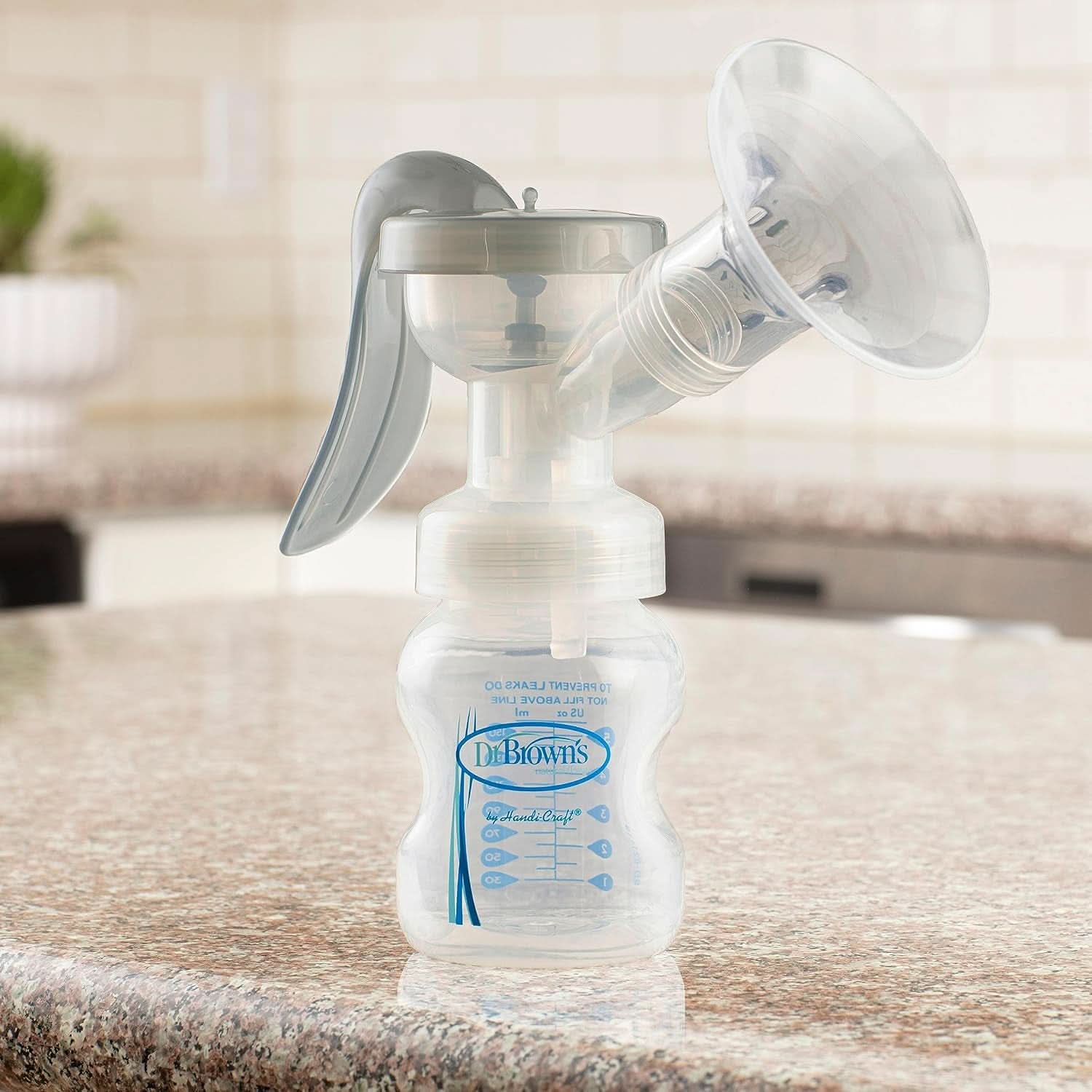 Laktator ręczny ze 100% silikonem Ochrona Softshape (B, kołnierz 25 mm) i opcjami antykolkowymi + Butelka 150 ml z szeroką szyjką i smoczkiem o wolnym przepływie poziomu 1 Akcesoria Żywność i karmienie piersią Sklep Bebe Naty