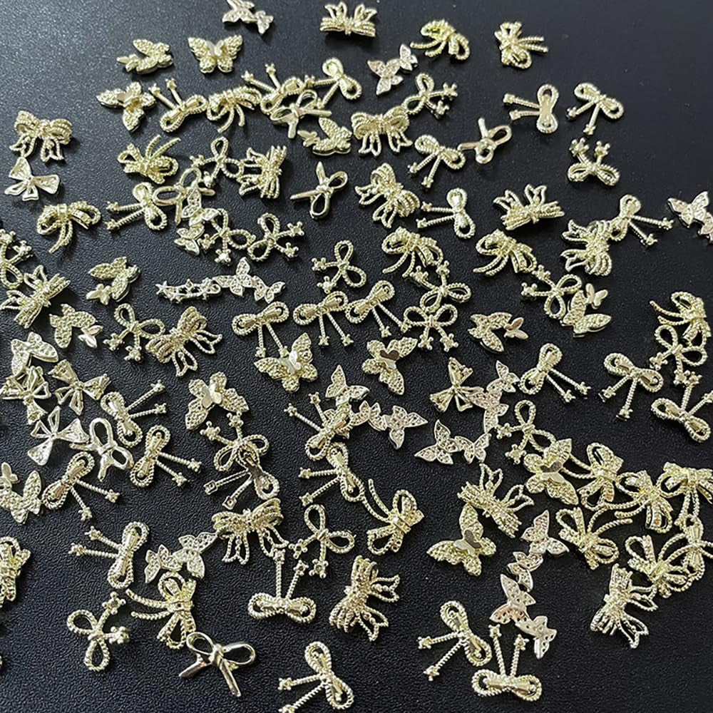 50Stück 3D Złota kokardka Charms do paznokci Motyl Nail Art Charms Legierung Bogen Nagel Charms Nägel Zubehör Schleife Nagelschmuck Metall Schleifen Schmetterling Nageldesign Nagelanhänger Nailart Strasssteine