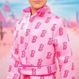Barbie The Movie - Ken-Sammelpuppe, Ryan Gosling jako Ken w różowym kombinezonie z „B”-Aufdruck, weißen Sneakern i bunten Inlineskates, JCP80
