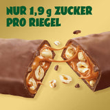 Przed nami batoniki czekoladowe z karmelem i orzechami laskowymi | 12 tabliczek czekolady x 35 g bez dodatku cukru | 1,9 g cukru na batonik | Chrupiący smak orzecha laskowego i karmelu | Słodycze o niskiej zawartości węglowodanów | Żadnego oleju palmowego