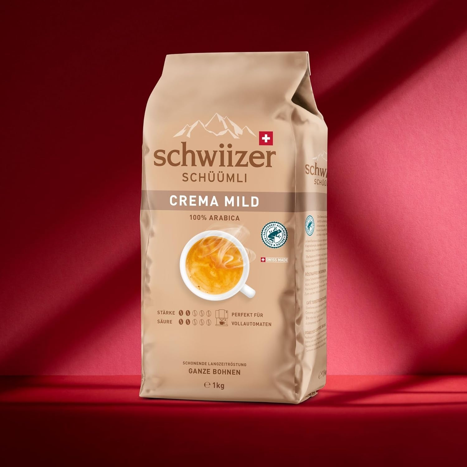 Schwiizer Schüümli Crema Mild, 100% ziaren kawy premium Arabica, owocowe i orzechowe, do w pełni automatycznych ekspresów do kawy, moc 2/5, jasno palona, ​​certyfikat Rainforest Alliance, 1 kg (opakowanie 2 szt.)