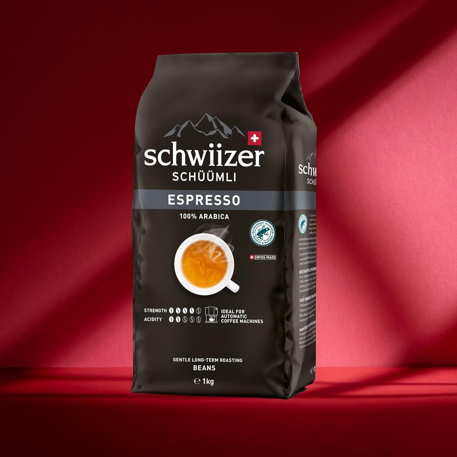Schwiizer Schüümli Espresso, kawa ziarnista 100% Arabica, mocna i intensywna, idealna do automatycznych ekspresów ciśnieniowych, moc 4/5, średnio palona, ​​Rainforest Alliance, 1kg