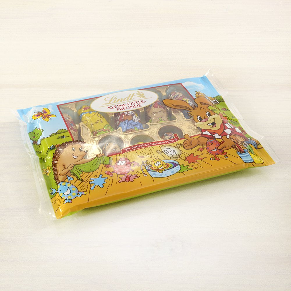 Mali Wielkanocni Przyjaciele z Czekoladą | 2 x 100 g i dekoracja czekoladowa Mini jajka z mlekiem alpejskim | 2 x saszetki 180 g | Jajka premium z mlecznej czekolady, radośnie i kolorowo opakowane, w czterech kolorach na Wielkanoc