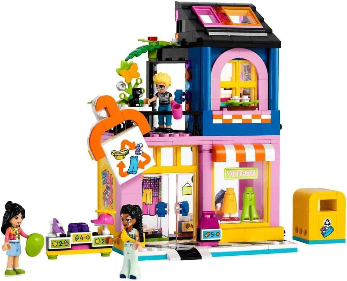 LEGO Friends Zestaw do budowania sklepu z modą vintage dla dzieci ze sklepem z zabawkami, figurkami i kotem, model do odgrywania ról zapewniający rozwój społeczno-emocjonalny, prezent dla 6-letnich dziewcząt i chłopców 42614 Zestawy do budowania Besuche den LEGO-Store