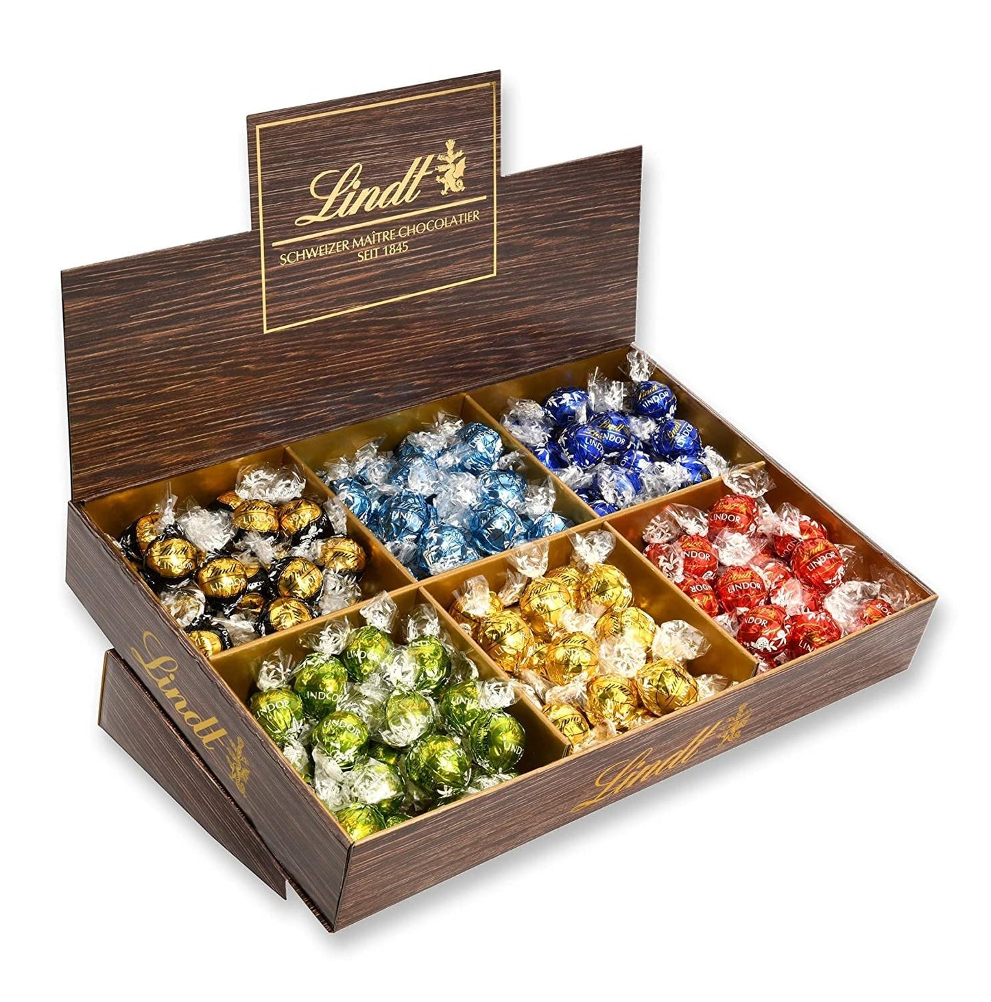 Prezentacja topu czekoladowego Lindor | 1718 g i tabliczki czekolady z marcepanem | 25 batonów x 50g w displayu naladowym | 1250 g | Czysty marcepan oblany ciemną czekoladą | Batony czekoladowe