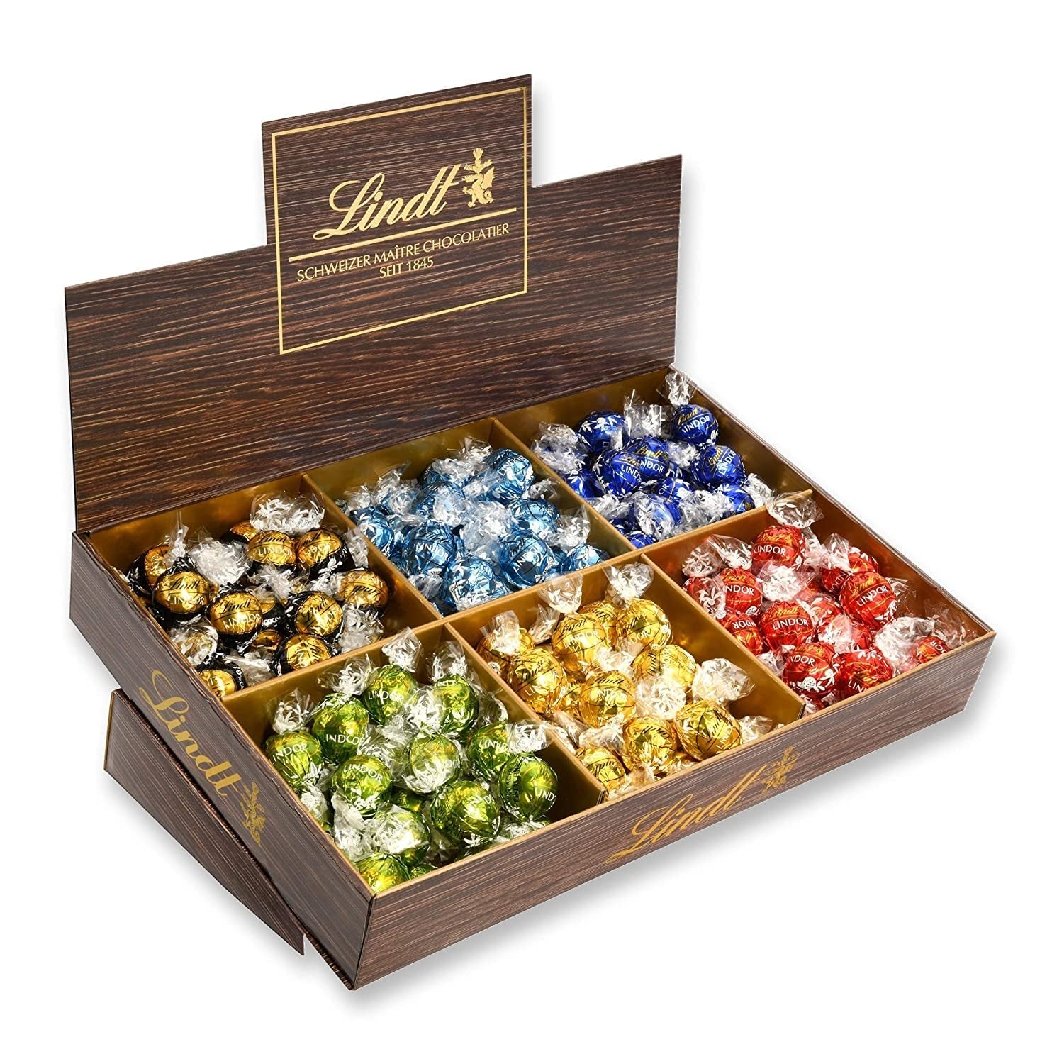 Prezentacja topu czekoladowego Lindor | 1718 g i tabliczki czekolady z marcepanem | 25 batonów x 50g w displayu naladowym | 1250 g | Czysty marcepan oblany ciemną czekoladą | Batony czekoladowe