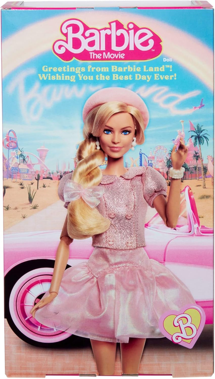 Barbie Film na podstawie filmu Margot Robbie jako figurka kolekcjonerska Barbie w różowej bluzce i tiulowej spódnicy ze stylizowaną fryzurą i pasującą biżuterią JBJ53