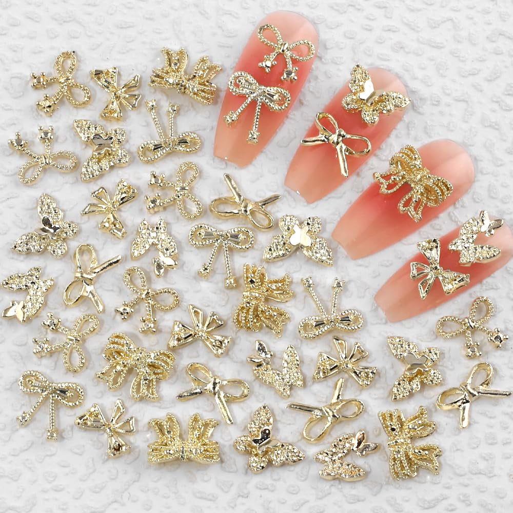 50Stück 3D Złota kokardka Charms do paznokci Motyl Nail Art Charms Legierung Bogen Nagel Charms Nägel Zubehör Schleife Nagelschmuck Metall Schleifen Schmetterling Nageldesign Nagelanhänger Nailart Strasssteine