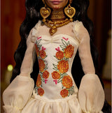 Lalka Barbie Signature Day of the Dead 2025 Figurka kolekcjonerska w kremowej sukience z falbankami, nagietkami i kokardkami, kwiatową koroną we włosach i farbą do twarzy Calavera, JBJ05