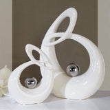 GILDE Dekoracyjna rzeźba ceramiczna Życie - biała szkliwiona biało-srebrna figurka ze srebrną kulą - wysokość 22 cm Figurki i rzeźby Naty Shop
