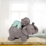 Posąg Zen'Light Budda Bonze śpiący na słoniu - Atmosfera Zen w Twojej świętej przestrzeni - piękna pomyślna figura - wys. 9,5 cm, brązowo-zielona. Figurki i rzeźby Naty Shop